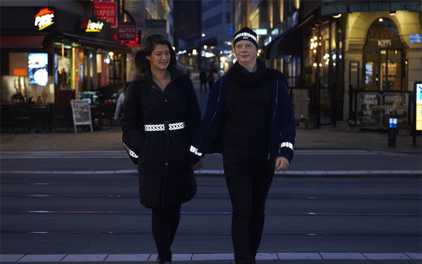 Couple wearing high quality reflective items by Smart in the dark on an evening walk