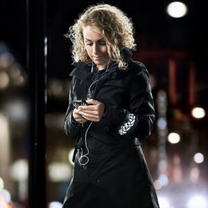 Girl with smartphone wearing Smart in the dark Wrinkled reflective arm band