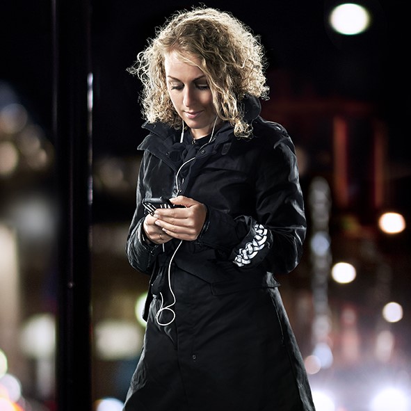 Girl with smartphone wearing Smart in the dark Wrinkled reflective arm band
