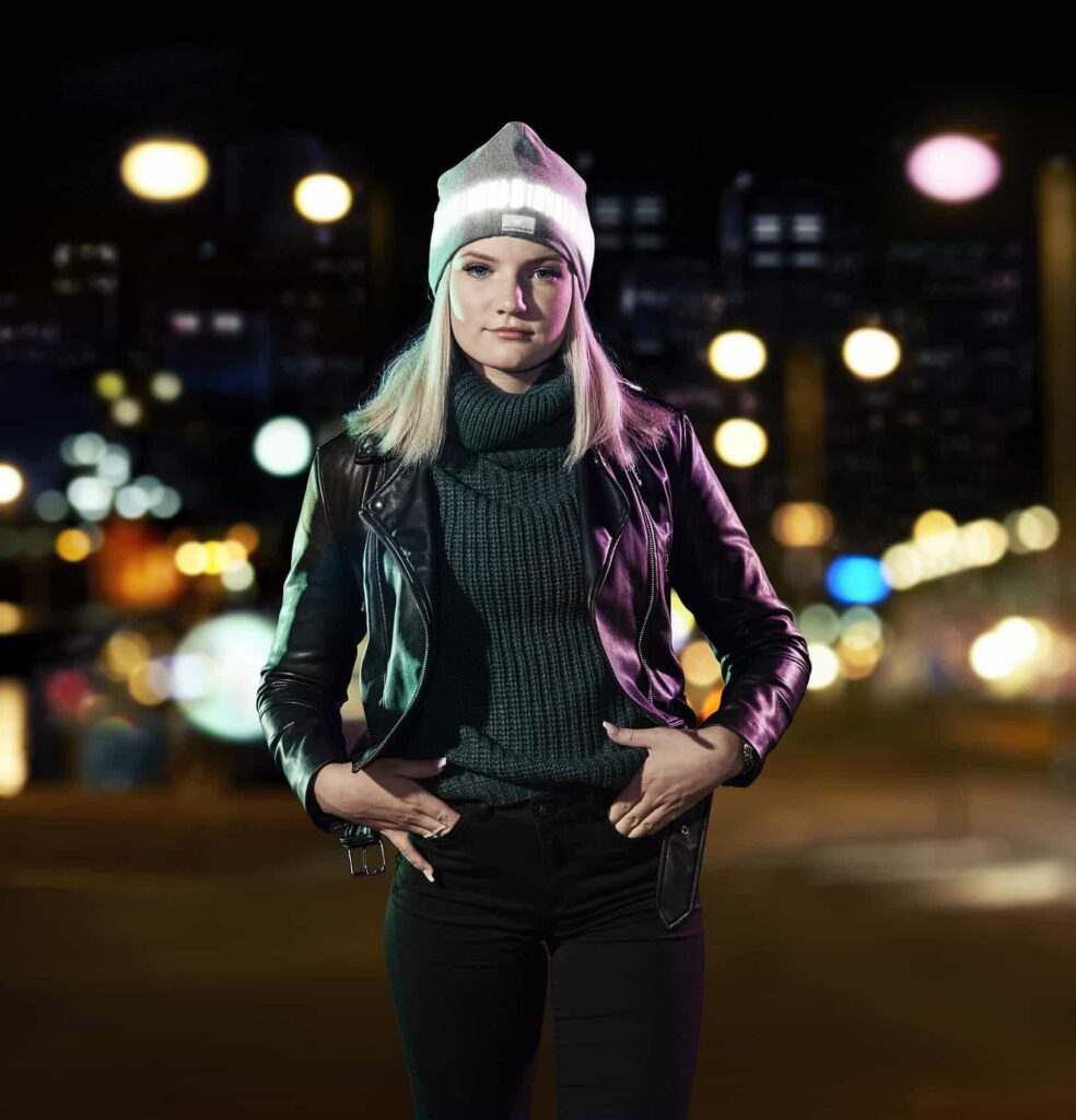 Reflective Gear for Walking at Night - Girl with Smart in the dark Reflective Beanie out walking