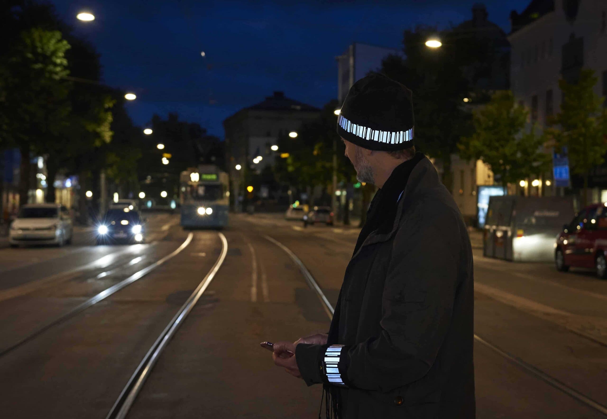 Man wearing high quality reflective items from Smart in the dark in traffic at night
