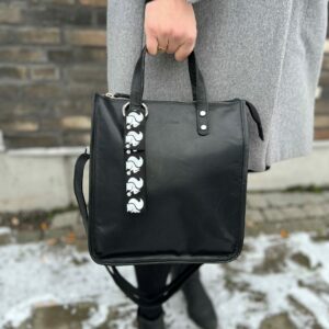“Our stylish black ELNA bag charm with reflective material for visibility in the dark. Design: Squirrel, Smart in the dark