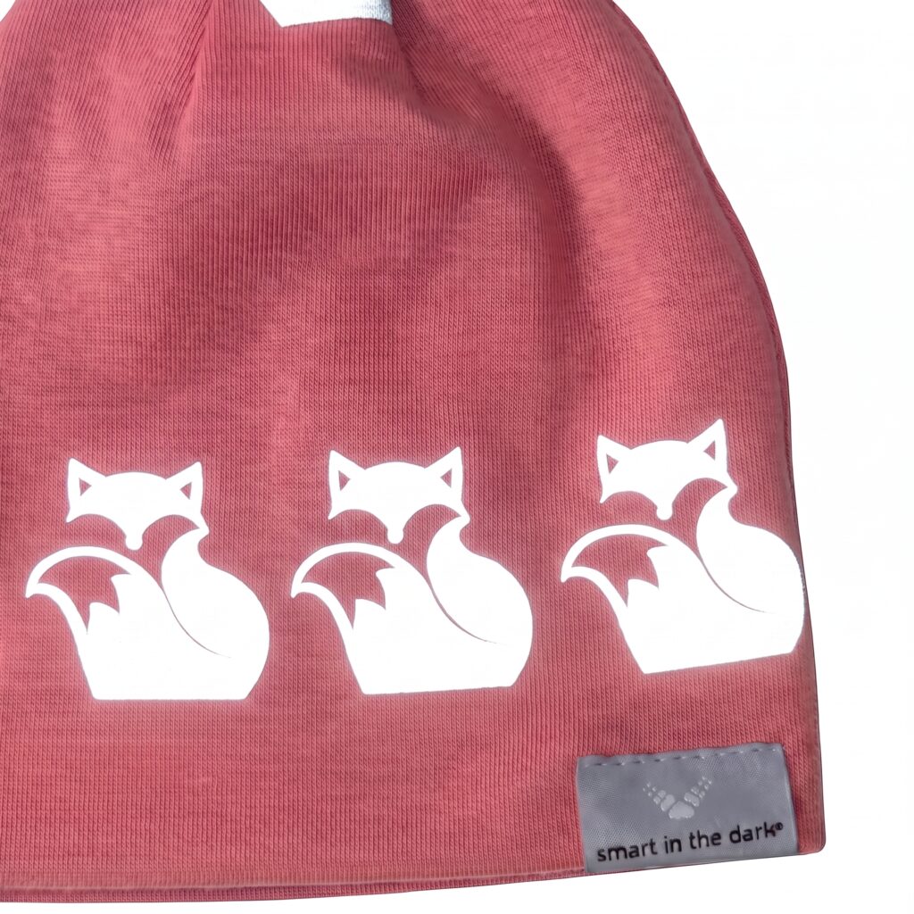 Close-up of bright fox pattern on Pink Peony kids reflective hat from Smart in the dark